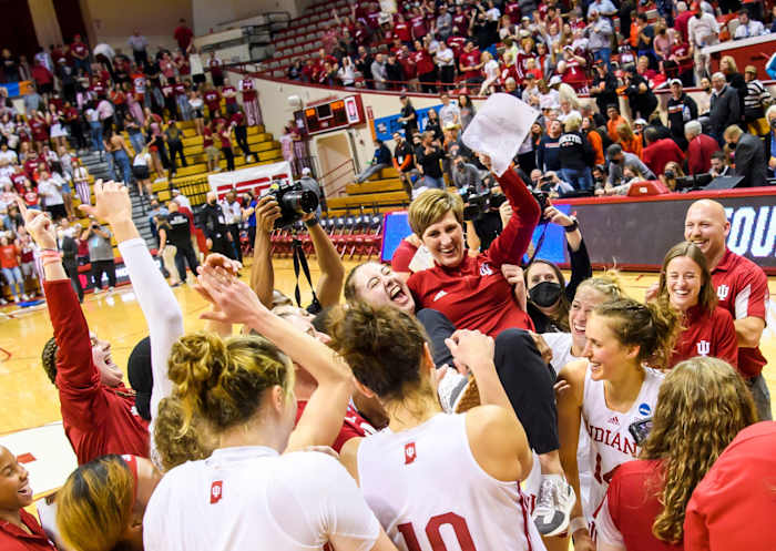 The Indiana women's basketball team holds up Coach Teri Moren after advancing to the Sweet Sixteen.